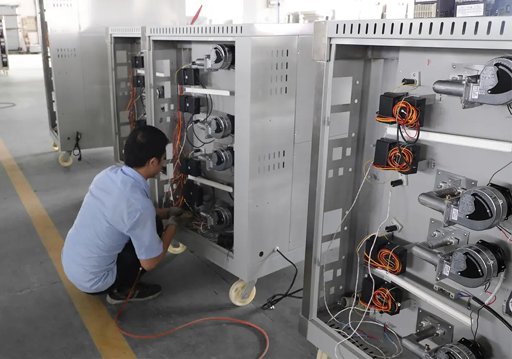 Professional kitchen equipment being assembled and tested in Grace factories