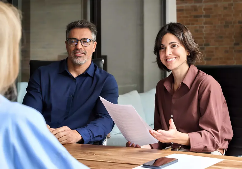 Professional kitchen design consultants listening to client requirements for custom commercial kitchen solutions